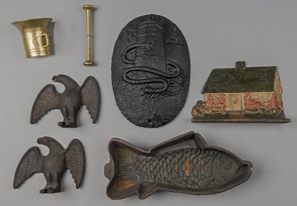 Group of metalware, to include two eagle snow bir: Group of metalware, to include two eagle snow birds, a fire mark, a cottage door stop, etc.