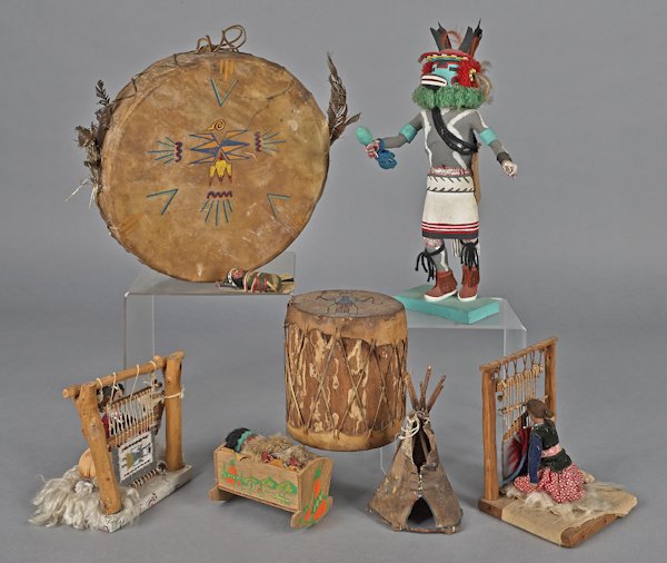 Collection of Native American souvenir items, 20t: Collection of Native American souvenir items, 20th c., to include two drums, a tepee, two doll weavings, a baby in a cradle, and two Kachina dolls, one signed Joseph Gash, 18'' h.