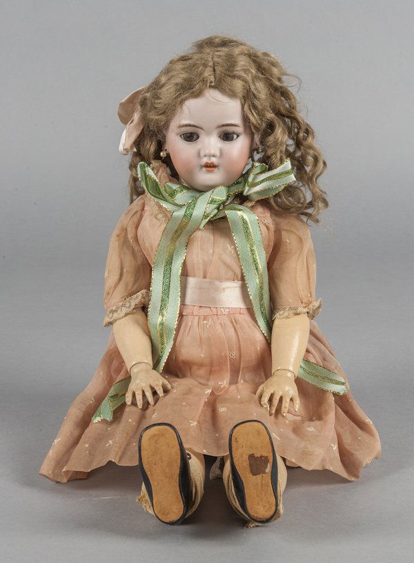 Simon & Halbig bisque doll, 19th c., stamped S&H: Simon & Halbig bisque doll, 19th c., stamped S&H 1070, with a jointed composition body, 20'' h.