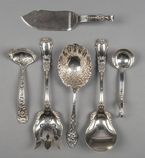 Group of sterling silver serving utensils, 21 ozt: Group of sterling silver serving utensils, 21 ozt.