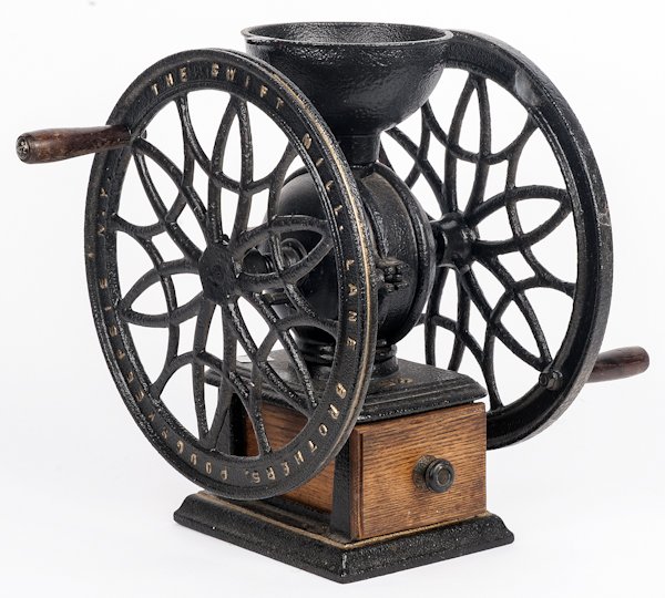 The Swift Mill Lane Brothers iron coffee mill,: The Swift Mill Lane Brothers iron coffee mill, 17 1/4'' h., together with a wooden churn, 17'' h.