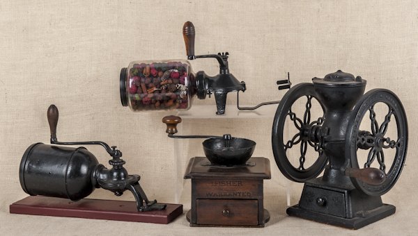 Landeris Frary & Clark iron coffee mill, 12'' h.: Landeris Frary & Clark iron coffee mill, 12'' h., together with a J. Fischer coffee mill and two grinders.