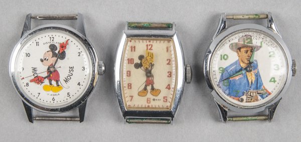 Three character wristwatches, to include two Mick: Three character wristwatches, to include two Mickey Mouse and one John Wayne, no bands, stainless.