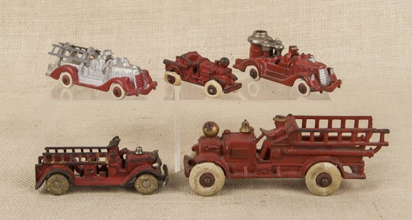Two Hubley Ahren Fox ladder trucks, together with: Two Hubley Ahren Fox ladder trucks, together with an A. C. Williams ladder truck and two Hubley fire vehicles, longest - 7 1/2''.