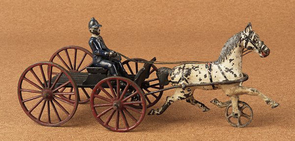 Harris cast iron buckboard wagon with a slat bed,: Harris cast iron buckboard wagon with a slat bed, 13'' l.