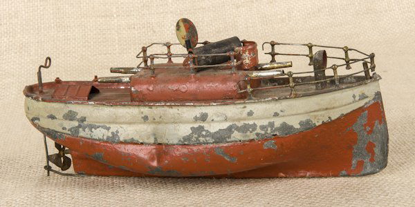 Tin clockwork ship, 9'' l.: Tin clockwork ship, 9'' l.