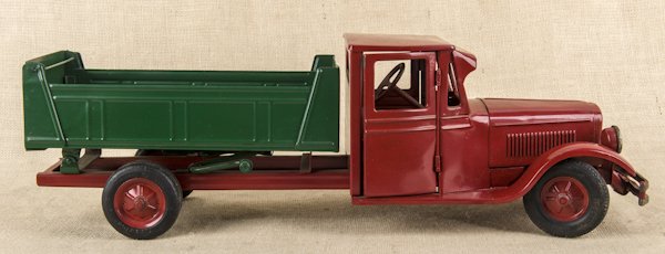 Buddy L pressed steel dump truck with a full cab,: Buddy L pressed steel dump truck with a full cab, 24'' l.