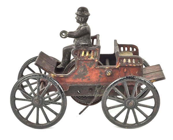 Cast iron wind-up horseless back to back trap, 6: Cast iron wind-up horseless back to back trap, 6 1/4'' l.