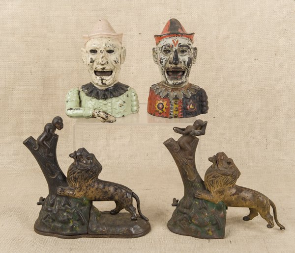 Two cast iron Lion and Monkey mechanical banks ma: Two cast iron Lion and Monkey mechanical banks manufactured by Kyser & Rex, together with two Humpty Dumpty banks.