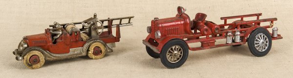 Two Hubley cast iron ladder trucks, 9 1/4'' l. and: Two Hubley cast iron ladder trucks, 9 1/4'' l. and 13'' l.