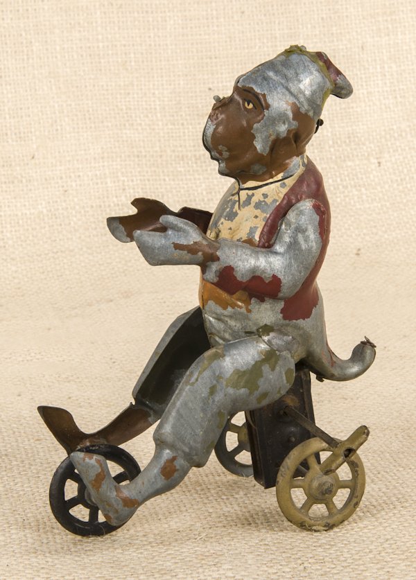 Two German tin wind-up toys, to include a rooster: Two German tin wind-up toys, to include a rooster, 5 1/2'' h., and a monkey, 6 1/4'' h.