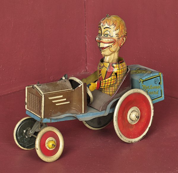 Marx tin litho Mortimer Snerd wind-up car, 7'' l: Marx tin litho Mortimer Snerd wind-up car, 7'' l.