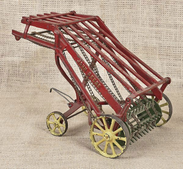 Vindex cast iron John Deer hay loader, with ori: Vindex cast iron John Deer hay loader, with original decal, 7 1/2'' h.