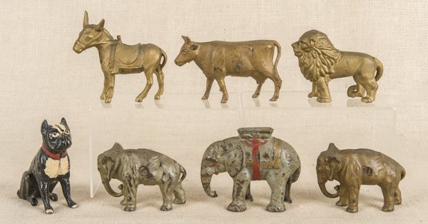 Six cast iron animal still banks, to include elep: Six cast iron animal still banks, to include elephants, a lion, a cow, and a donkey, tallest - 4 1/4'', together with an aluminum seated boxer.