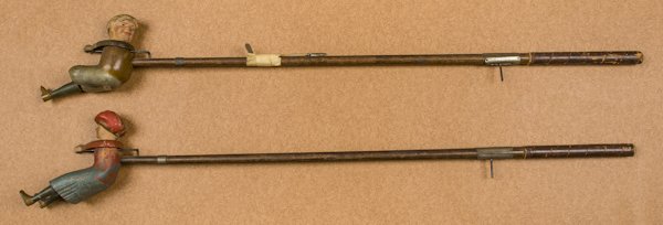 Two Schoenhut mechanical indoor golfers, to inclu: Two Schoenhut mechanical indoor golfers, to include a man and a woman, 36'' l.