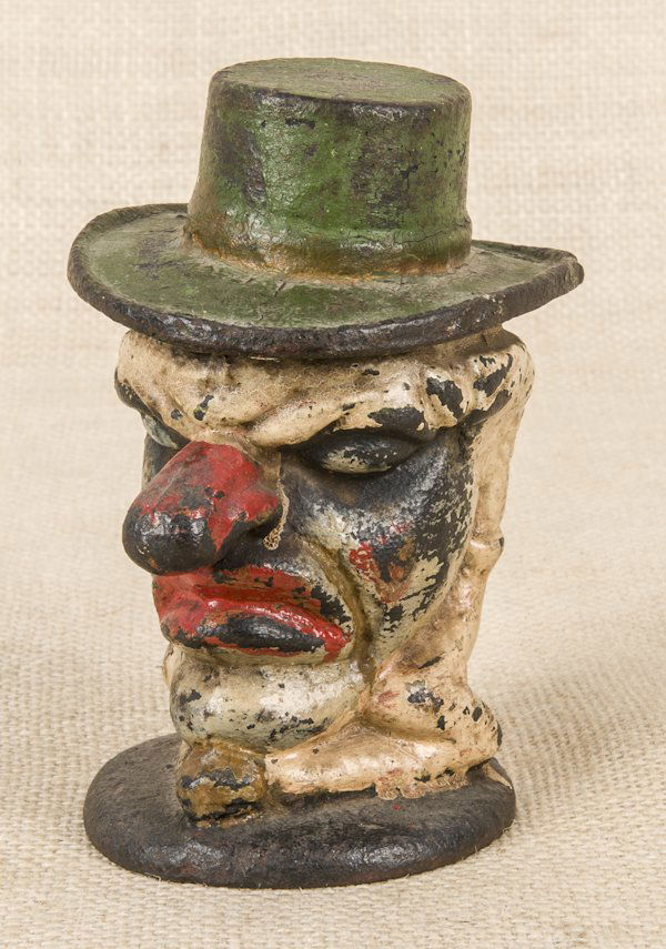 Figural cast iron clown covered box, 5 3/4'' h.: Figural cast iron clown covered box, 5 3/4'' h.