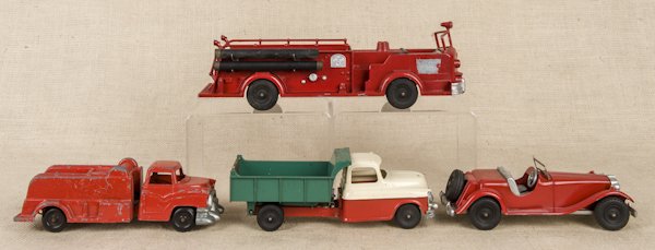 Four Hubley die cast vehicles, to include two lad: Four Hubley die cast vehicles, to include two ladder trucks, a dump truck, and a roadster, longest - 14''.