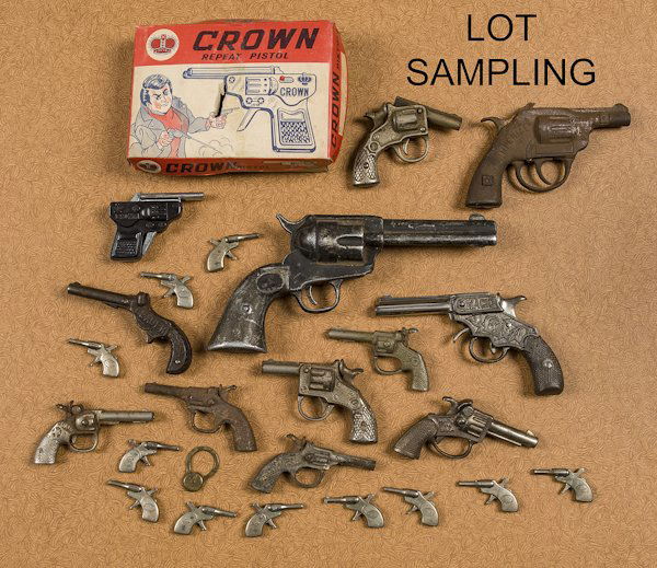 Group of cast iron, nickel, and tin cap guns, to: Group of cast iron, nickel, and tin cap guns, to include Leader, Magic, etc., longest - 6 1/2''.