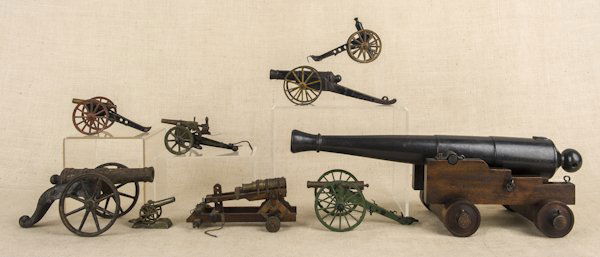 Nine cast iron and wood cannons, to include one: Nine cast iron and wood cannons, to include one Marklin, largest barrel - 20'' l.