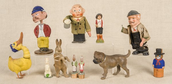 Group of composition candy containers and nodders: Group of composition candy containers and nodders, to include a gentleman in a cap, rabbits, a dog, etc., tallest - 8''.