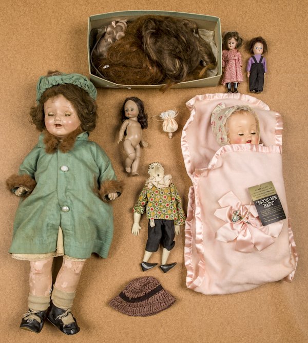 P & B Doll Co. Rock-Me-Baby in original cradle: P & B Doll Co. Rock-Me-Baby in original cradle box, together with a composition doll, an Alex doll, and miscellaneous doll wigs, tallest - 21 1/2''.