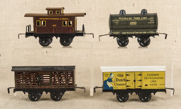 Four tin Bing train cars, to include a caboose, a: Four tin Bing train cars, to include a caboose, a box car, an Old Dutch Cleanser box car, and a tank car, 5 3/4'' l.