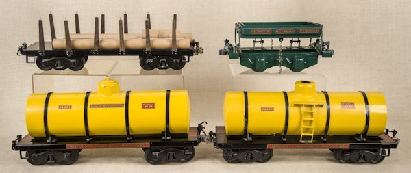 Five reproduction Buddy L pressed steel garden tr: Five reproduction Buddy L pressed steel garden train cars, one with its original box, longest - 20''.