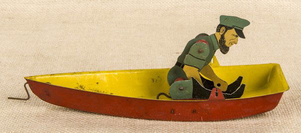 Emmert Hammes and Co. tin litho Barnacle Bill in: Emmert Hammes and Co. tin litho Barnacle Bill in a row boat rubber band toy, 9'' l.