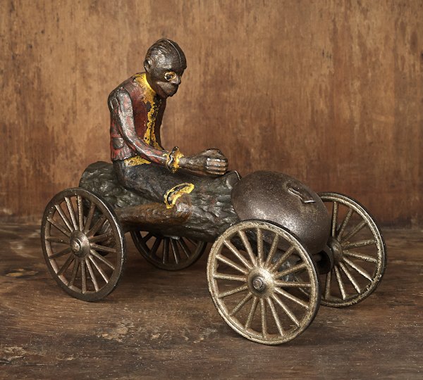 Cast iron monkey on a log bell toy manufactured b: Cast iron monkey on a log bell toy manufactured by the N. N. Hill Brass Co., 6 1/4'' l.