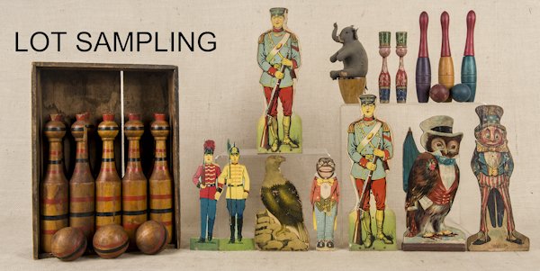 Group of cardboard and paper litho skittles, to i: Group of cardboard and paper litho skittles, to include nine soldiers, a Palmer Cox brownie Uncle Sam, an eagle, and an owl, tallest - 13'', together with a wooden skittle set in its original box, woo