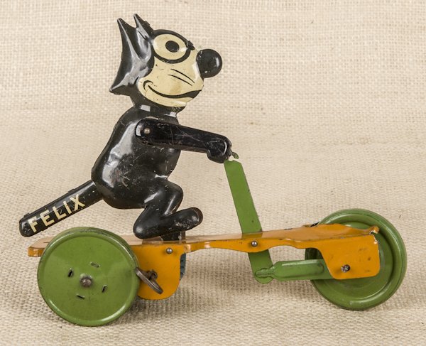 Tin wind-up Felix the Cat on a scooter, 8'' l.: Tin wind-up Felix the Cat on a scooter, 8'' l.