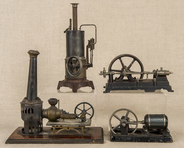 Four cast iron and tin live steam boilers and acc: Four cast iron and tin live steam boilers and accessories, to include Martex Engine, tallest - 11 1/2''.