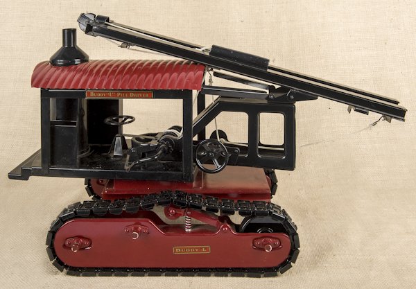 Reproduction Buddy L pile driver on treads, 24'' l: Reproduction Buddy L pile driver on treads, 24'' l.