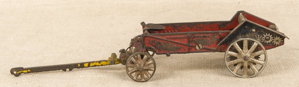 Arcade cast iron McCormick Deering spreader, 14: Arcade cast iron McCormick Deering spreader, 14 1/2'' l.