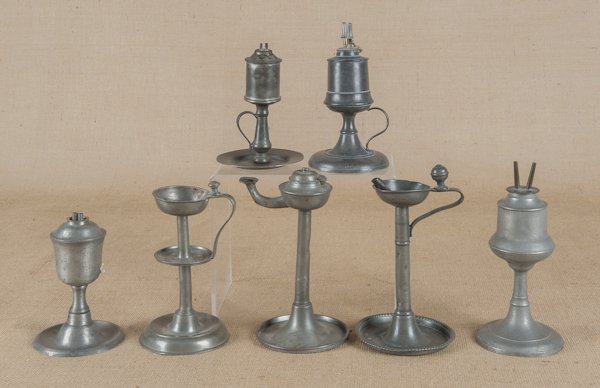 Four American pewter oil lamps, to include three: Four American pewter oil lamps, to include three European fat lamps.