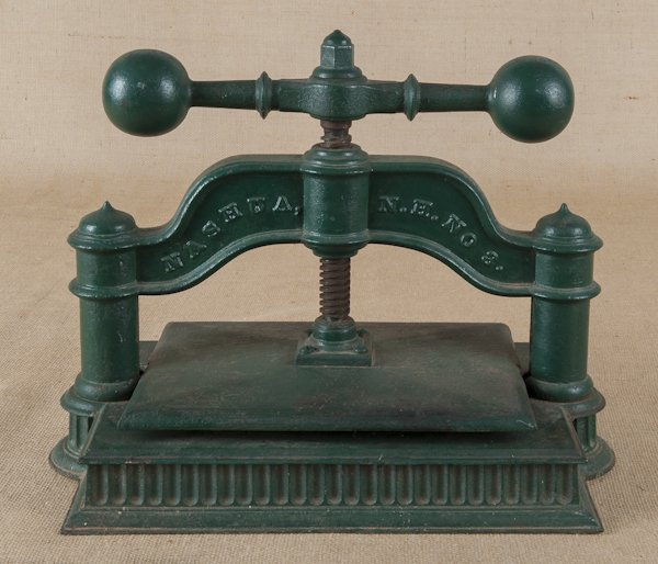 Warner & Whitney cast iron press, in green paint,: Warner & Whitney cast iron press, in green paint, 14'' h., 19'' w.