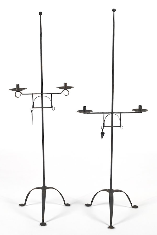 Two wrought iron candlestands, 20th c., 57 1/2'' h: Two wrought iron candlestands, 20th c., 57 1/2'' h. and 58 1/4'' h.