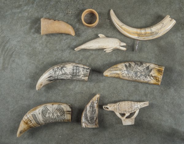 Five nautical bone and ivory carvings, together w: Five nautical bone and ivory carvings, together with four composition whale teeth.