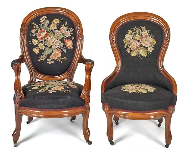 Two Victorian walnut chairs with needlepoint upho: Two Victorian walnut chairs with needlepoint upholstery.