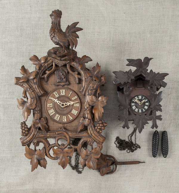 Two German cuckoo clocks, 21'' h. and 9'' h.: Two German cuckoo clocks, 21'' h. and 9'' h.