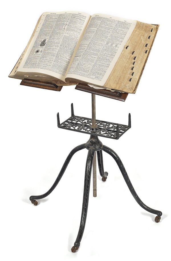 Oak and iron book stand, 33 1/2'' h., with an earl: Oak and iron book stand, 33 1/2'' h., with an early Webster's dictionary.