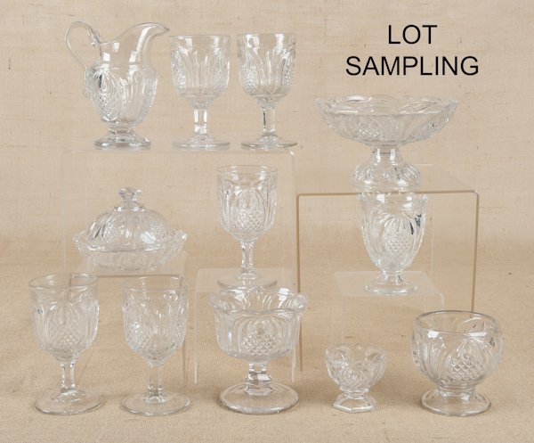 New England pressed glass tableware in the pineap: New England pressed glass tableware in the pineapple pattern, late 19th c., including goblets, a compote, a covered dish, etc., approx. twenty-five pieces.