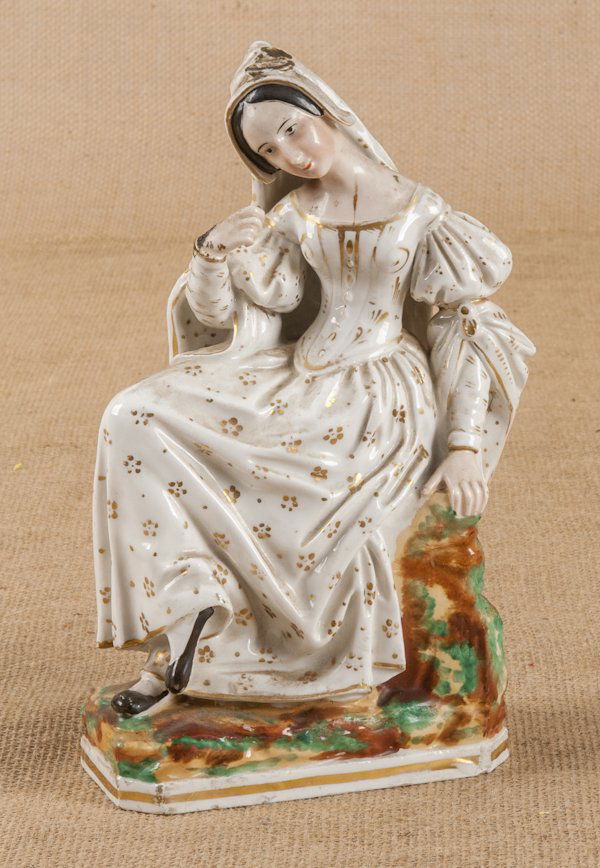 Stafforshire bottle, 19th c., of a seated woman,: Stafforshire bottle, 19th c., of a seated woman, 9 1/2'' h.