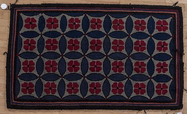 American hooked rug, early 20th c., in a floral p: American hooked rug, early 20th c., in a floral pattern, 38'' x 61''.