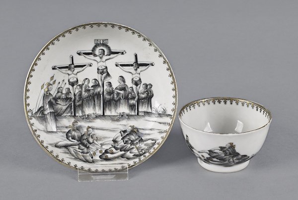 Chinese export porcelain Jesuit crucifixion cup: Chinese export porcelain Jesuit crucifixion cup and saucer en grisaille, ca. 1750, with gilt highlights. Provenance Matthew and Elisabeth Sharpe.