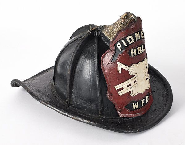 Leather fire helmet, ca. 1920, with brass eagle: Leather fire helmet, ca. 1920, with brass eagle front piece holder, inscribed Pioneer H & L W. F. D.