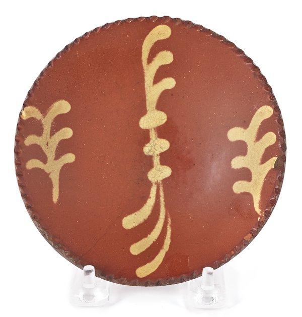 Miniature Pennsylvania redware pie plate, 19th c: Miniature Pennsylvania redware pie plate, 19th c., with yellow slip decoration, 5 1/4'' dia.