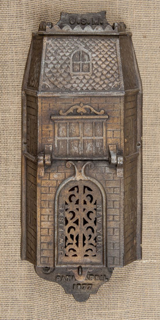 Cast iron house form mailbox, dated 1877, mad: Cast iron house form mailbox, dated 1877, made by J.W. Fiske, New York, 17'' h.