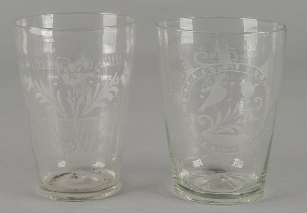 Two Steigel type etched flip glasses, ca. 1800,: Two Steigel type etched flip glasses, ca. 1800, one with a bird on a floral spray, 6 3/4'' h., the other with a basket of flowers, 6 1/2'' h.