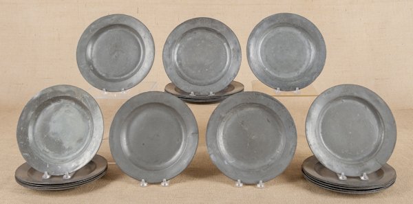 Set of twenty English pewter plates, ca. 1740,: Set of twenty English pewter plates, ca. 1740, bearing the touch of Jonathan Cotton, each with an engraved coat of arms on rim, 9 1/2'' dia.